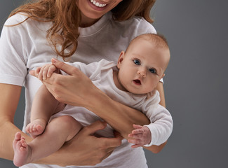 Charming baby looking at camera with opening mouth