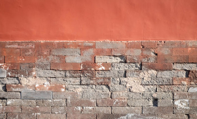The  old red brick wall with the cement