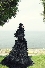 Fashion woman posing near the sea. 