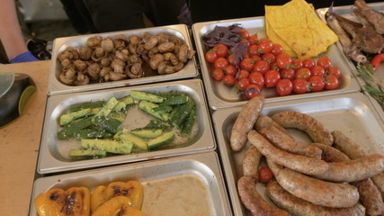 Fresh grilled food lies on the counter of the fast food restaurant grilled meat, grilled vegetables