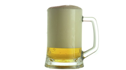 Beer mug on a which foam flows down.Oktoberfest