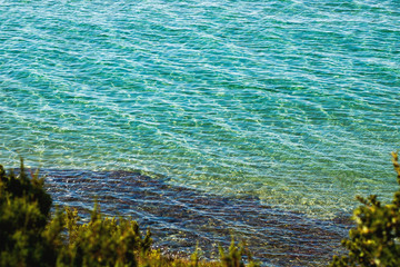 Beautiful view from the shore to the crystal clear water