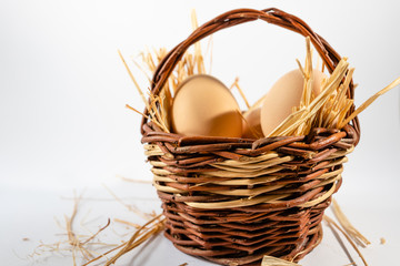 Easter eggs and basket isolated. White background. selective focus