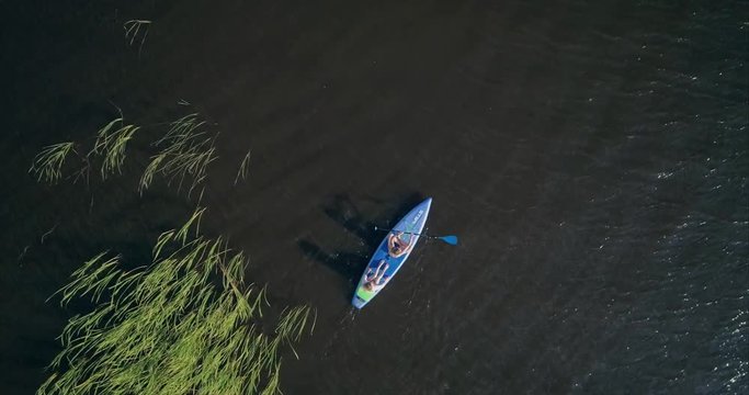 Two girls on the sup board, view frome above 1