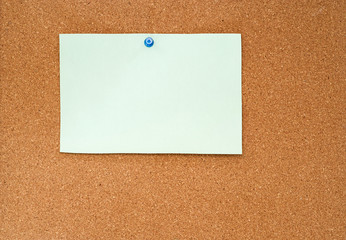 Pale Paper Pinned To Cork Board
