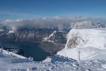 Fototapeta na wymiar Swiss mountain peak after snowfall with panoramic view of Lake Lucerne (Vierwaldstattersee)