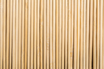 Round wooden sticks background. Close-up Wall Pattern