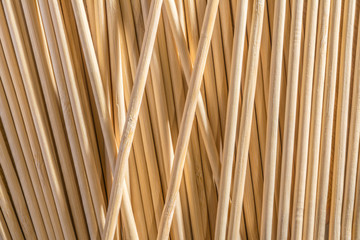 Round wooden sticks background. Close-up Wall Pattern