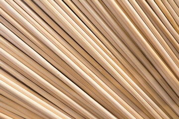 Round wooden sticks background. Close-up Wall Pattern