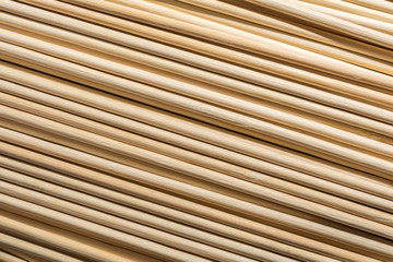 Round wooden sticks background. Close-up Wall Pattern