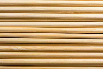 Obraz premium Round wooden sticks background. Close-up Wall Pattern