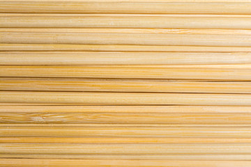 Round wooden sticks background. Close-up Wall Pattern