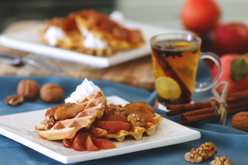 waffles sered with walnuts, honey and baked aples