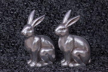 luxury metal easter bunnies in silver on dark background