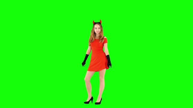 Woman Sending Air Kiss in Devil Horns on Green Screen