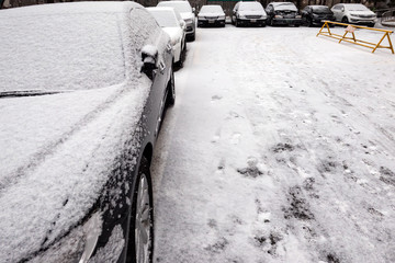 cars parking and car covered with snow