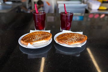 Traditional turkish drink turnip juice (Salgam) and turkish bagel