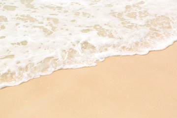 Fototapeta na wymiar Tropical beach background with soft wave and sand