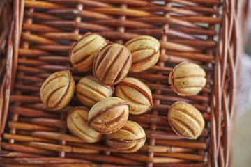 Traditional russian festive cookies in nut shape with caramelized milk inside