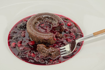 Chocolate fondant. Hot chocolate pudding with fondant center on plate, close-up. Chocolate lava...