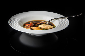 vegetarian soup with mushrooms, mozzarella cheese and dill