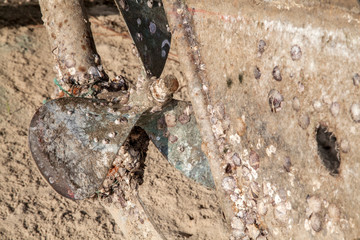 Old rusty boat engine propeller,