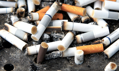 Cigarette butts in the urn, close-up.