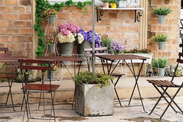 Fototapeta na wymiar Set chairs of vintage style in garden