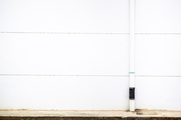 Empty white concrete wall and water pipe background.