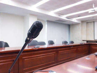 Conference microphones on the table in the conference room.