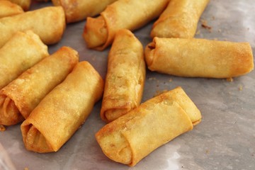 fried spring rolls in pan at street food