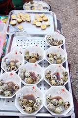 Quail eggs with sauce in street food