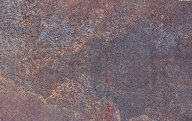 Rust on surface of the old iron plate. Deterioration of the steel. Texture of the rusty metal.
