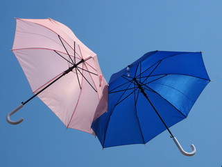Umbrellas dance in the sky