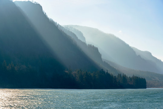 Mountain range illuminated by the slanting rays of the sun on the banks of the Columbia River in Colombia Gorge
