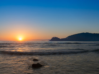 Fototapeta na wymiar Beautiful sunrise over beach