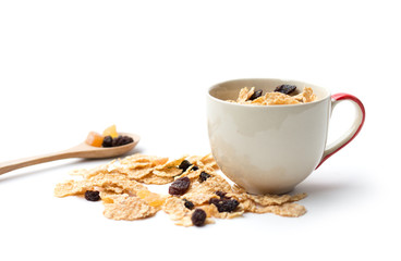 whole grain cereal flakes which mixed berry fruit and raisins for breakfast isolaed on white background