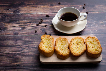 Cup of coffee with garlic bread