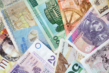 Different countries money background close up. Belarusian rubles, Georgian lari, Polish zloty, Israeli shekels, Vietnamese dongs