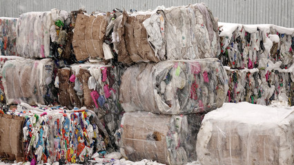 Plastic bales of garbage at the waste processing plant. Processing and storage of waste for further...