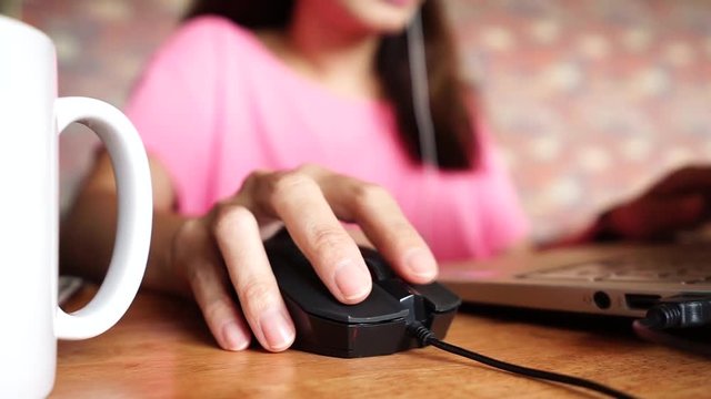 Hand using Computer mouse for online business work	