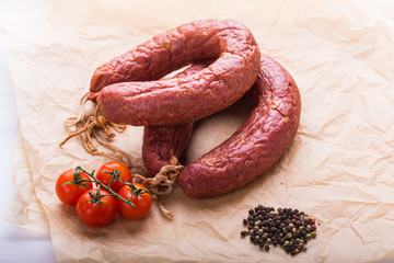 Food concept- Traditional Kazakh horse meat sausage with tomato and pepper