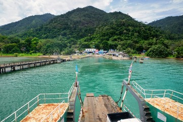Ferry ramp, turquoise tropical sea and ferry pier on tropical Koh Chang island in Thailand