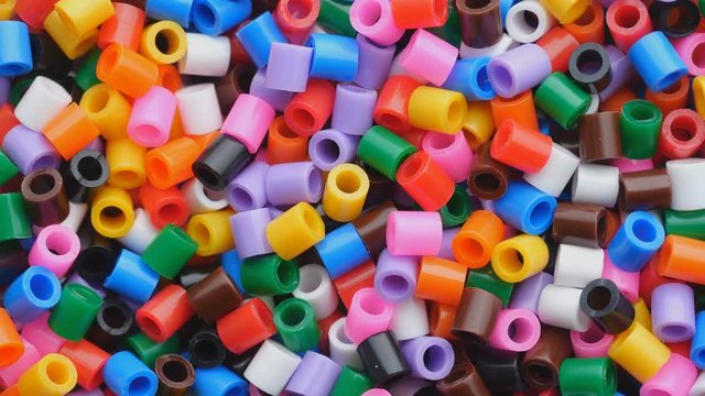 Colorful fusible plastic beads. Close up.