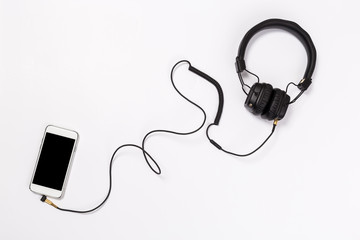 Headphones with Smartphone on white background