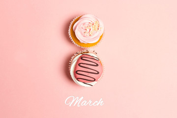 Cupcakes in shape of number 8 on pink pastel background.  March 8.