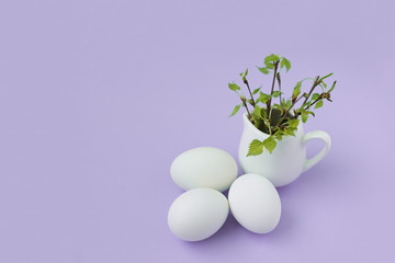 happy Easter eggs and branch  lilac background