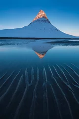 Wallpaper murals Kirkjufell Icelands snaefellsnes peninsula and famous Kirkjufell. Kirkjufell is a beautifully shaped and a symmetric, free standing mountain in Iceland. Frozen view of Kirkjufell (church mountain).