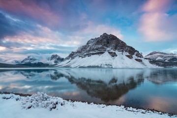 Early morning sunrise at the Bow lake and Crowfoot mountain, Banff national park. Bow Lake is a small lake in western Alberta, Canada. It is located on the Bow River, in the Canadian Rockies