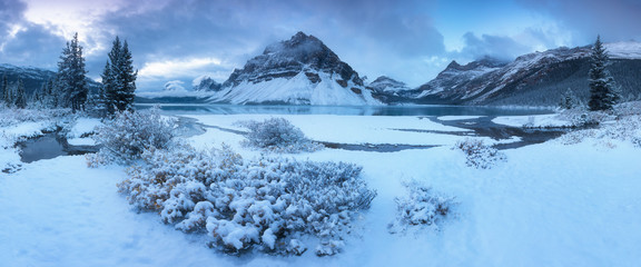 Early winter morning sunrise at the Bow lake and Crowfoot mountain, Banff national park. Bow Lake is a small lake in western Alberta, Canada. It is located on the Bow River, in the Canadian Rockies
